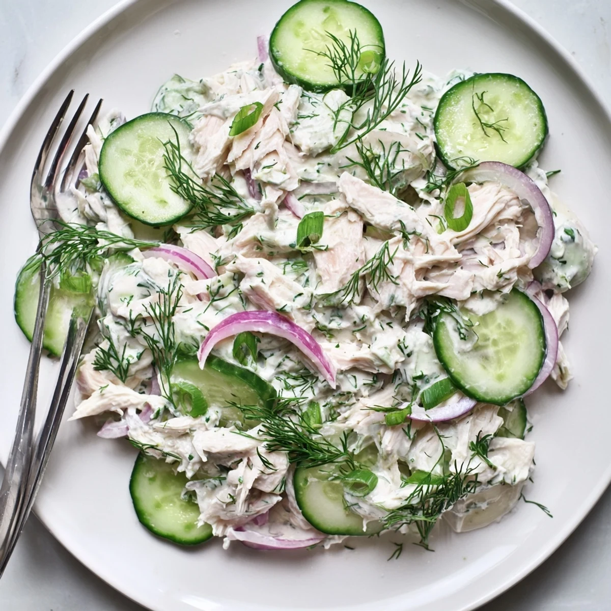 This Creamy Cucumber Chicken Salad features juicy diced chicken and crisp cucumber slices in a creamy dill yogurt dressing.